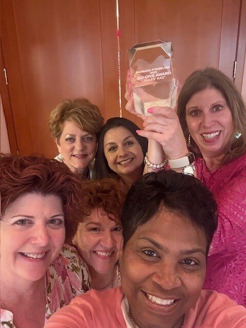 Barbara Podbelsek, Mary Kay Go Give Winner, and coworkers