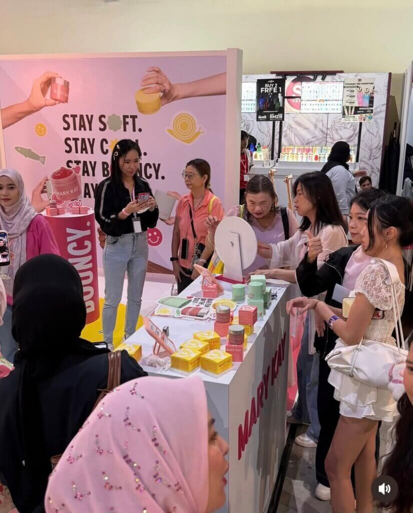 women gather in Malaysia around Mary Kay K-Beauty Products