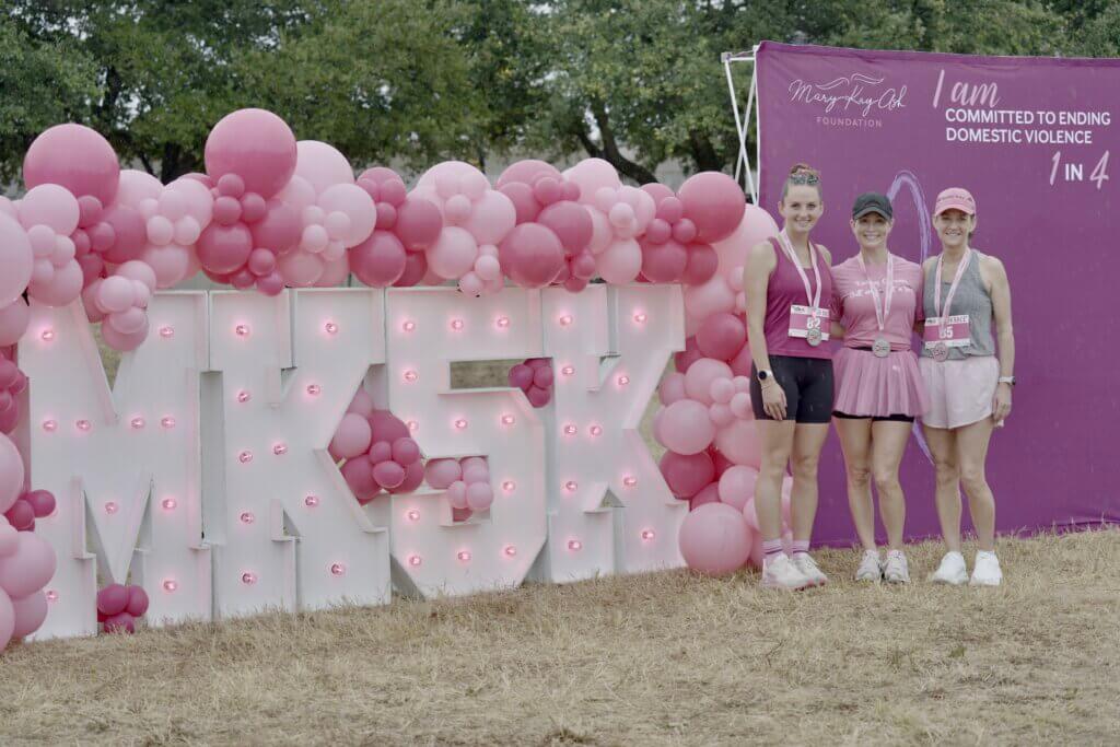 two women with MK5K sign at the Mary Kay Ash Foundation 5K race